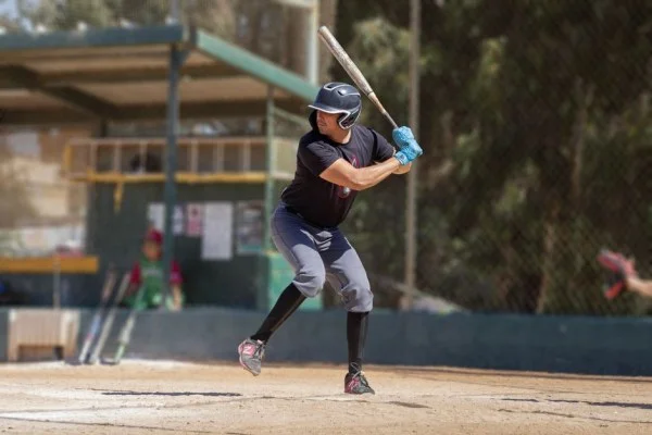 baseball player swinging bat